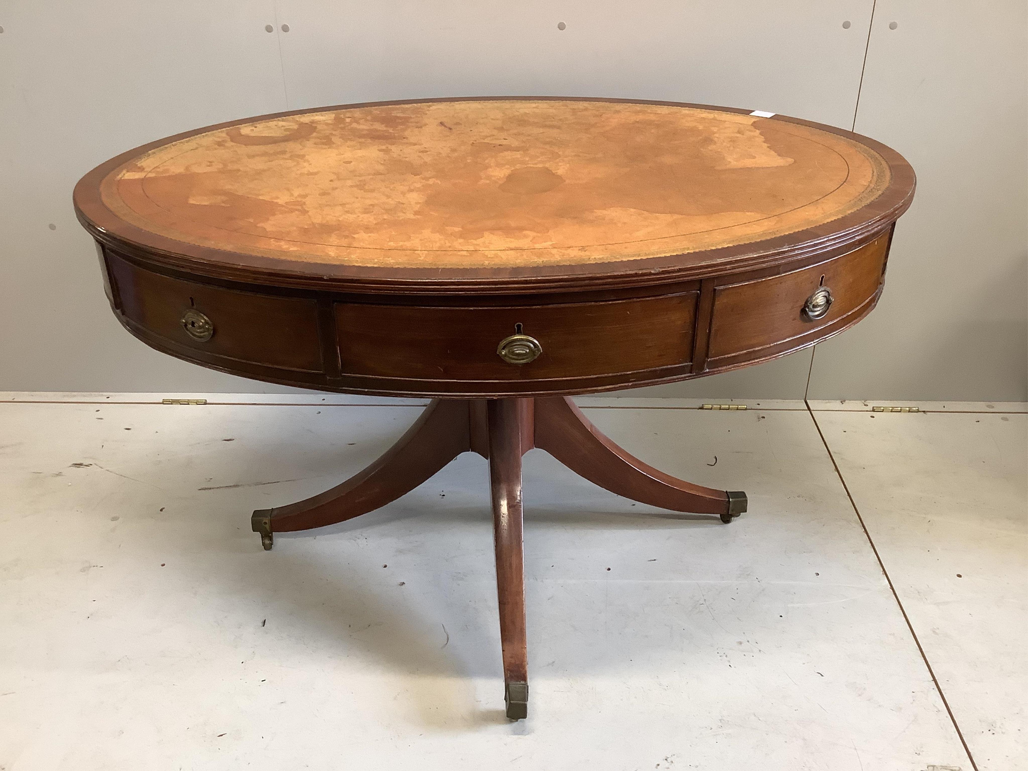 A Regency oval mahogany drum table, width 122cm, depth 94cm, height 76cm. Condition - fair